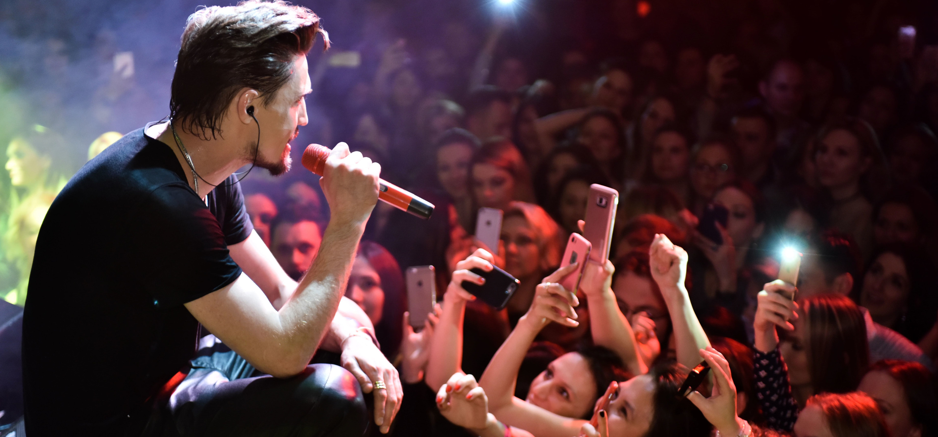 Crowds cheering at a live concert